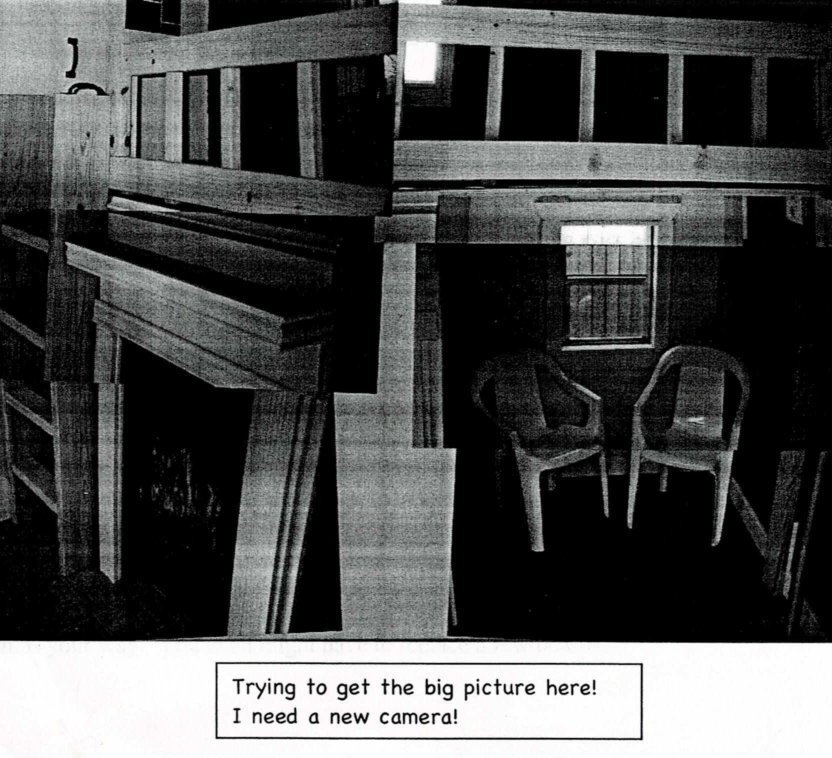 Black-and-white scan of a document. It features a composite of multiple images of the fireplace, loft, and the "kitchen," a small room under the right side of the loft with two plastic chairs and a window. It is difficult to make out details. Text is written under the image: "Trying to get the big picture here! I need a new camera!"