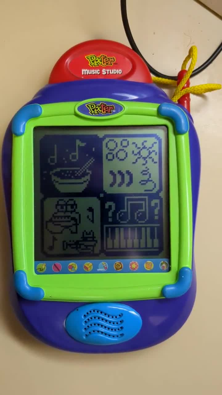 An original model Pixter device. Its screen is low-res and not backlit, and the design is very toy-like; colorful and childish.
