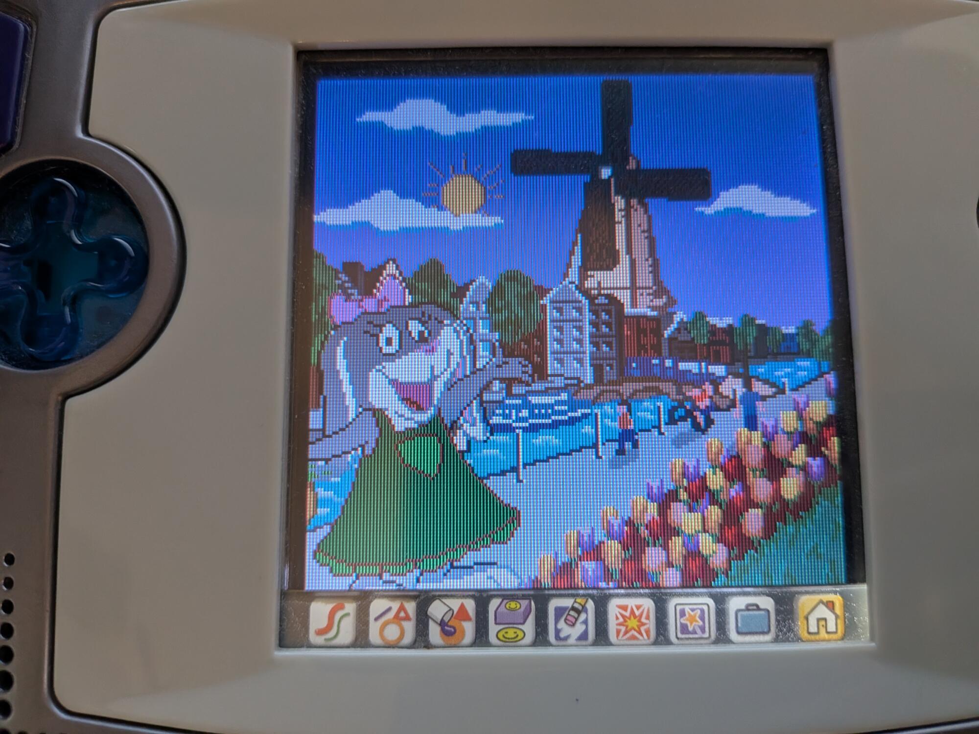 Screenshot of "Learning: Global Passport." Pictured is the game's depiction of Amsterdam. A riverside city has flowers lined along the path, and a windmill can be seen in the distance. A bunny character in a green dress greets the player.